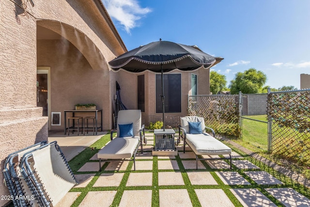 view of patio / terrace featuring fence