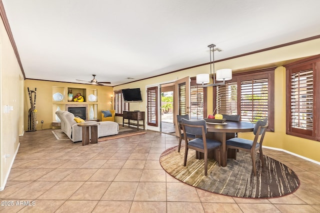 31453 N Blackfoot Dr, San Tan Valley, AZ 85143 - dining room featuring crown molding, a ceiling fan, light tile patterned floors, baseboards, and a chandelier