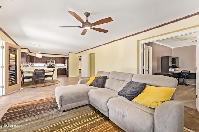 31453 N Blackfoot Dr, San Tan Valley, AZ 85143 - living area featuring ornamental molding, light tile patterned floors, a ceiling fan, arched walkways, and an office area