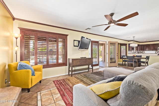 31453 N Blackfoot Dr, San Tan Valley, AZ 85143 - living area featuring ceiling fan, ornamental molding, and baseboards