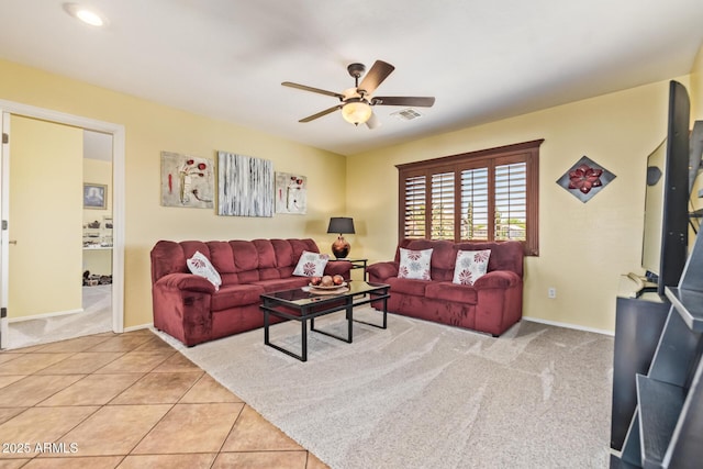 31453 N Blackfoot Dr, San Tan Valley, AZ 85143 - carpeted living area with a ceiling fan, tile patterned flooring, and baseboards
