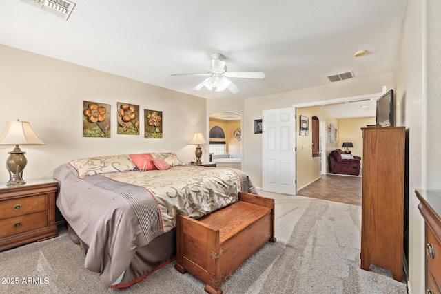 31453 N Blackfoot Dr, San Tan Valley, AZ 85143 - bedroom with arched walkways, carpet, a ceiling fan, and baseboards