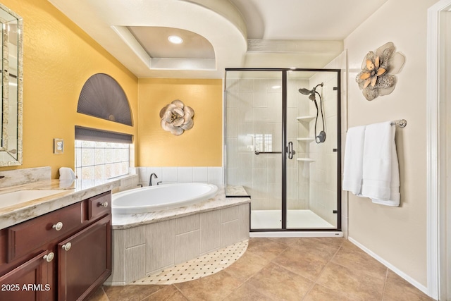 31453 N Blackfoot Dr, San Tan Valley, AZ 85143 - bathroom featuring a garden tub, vanity, a shower stall, tile patterned floors, and a tray ceiling