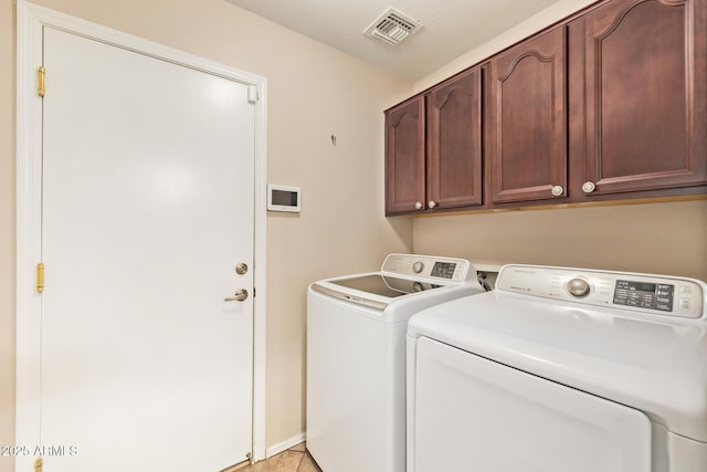 31453 N Blackfoot Dr, San Tan Valley, AZ 85143 - laundry room with cabinet space, washer and clothes dryer, and light tile patterned floors