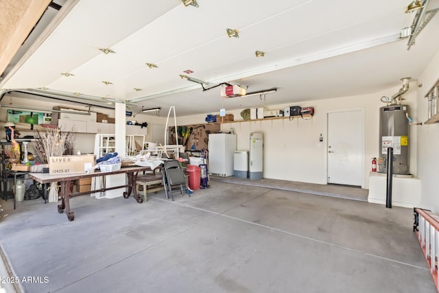 31453 N Blackfoot Dr, San Tan Valley, AZ 85143 - garage featuring gas water heater, freestanding refrigerator, and a garage door opener