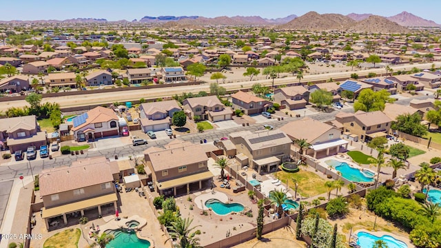31453 N Blackfoot Dr, San Tan Valley, AZ 85143 - aerial perspective of suburban area featuring a pool area and a mountainous background