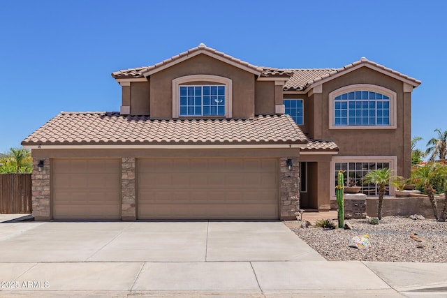 31453 N Blackfoot Dr, San Tan Valley, AZ 85143 - mediterranean / spanish-style home with stone siding, driveway, a tile roof, and stucco siding