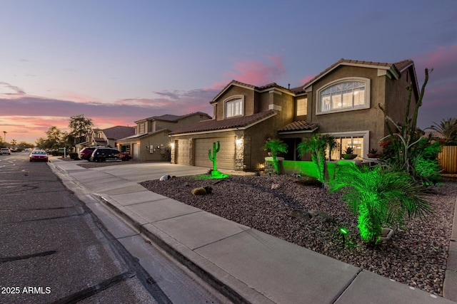 31453 N Blackfoot Dr, San Tan Valley, AZ 85143 - view of front facade with a tiled roof, concrete driveway, and stucco siding