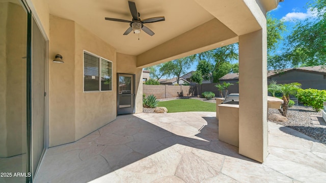 view of patio / terrace featuring a fenced backyard and a ceiling fan