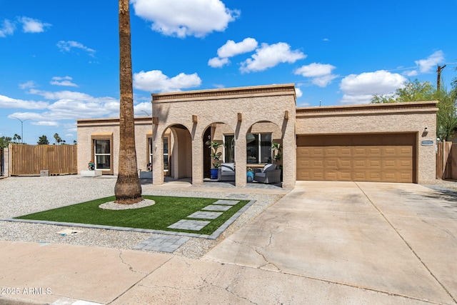 858 W Knowles Cir, Mesa, AZ 85210 - view of front of home with concrete driveway, an attached garage, an outdoor living space, and stucco siding