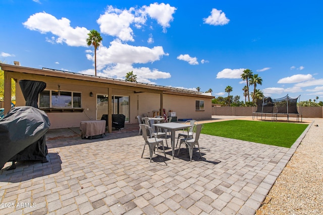 858 W Knowles Cir, Mesa, AZ 85210 - view of patio / terrace with a trampoline, grilling area, and outdoor dining space