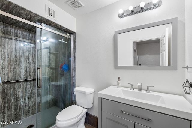 858 W Knowles Cir, Mesa, AZ 85210 - bathroom featuring vanity, toilet, and a shower stall