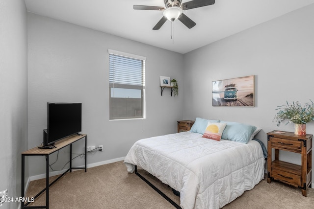 bedroom featuring baseboards, carpet, and a ceiling fan