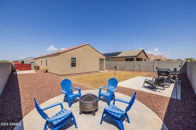 exterior space with a fire pit, a residential view, and a fenced backyard