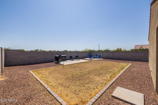 view of yard with a fenced backyard and a patio area