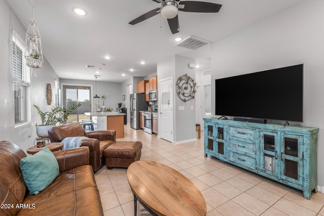 living room with recessed lighting, light tile patterned floors, a ceiling fan, and visible vents