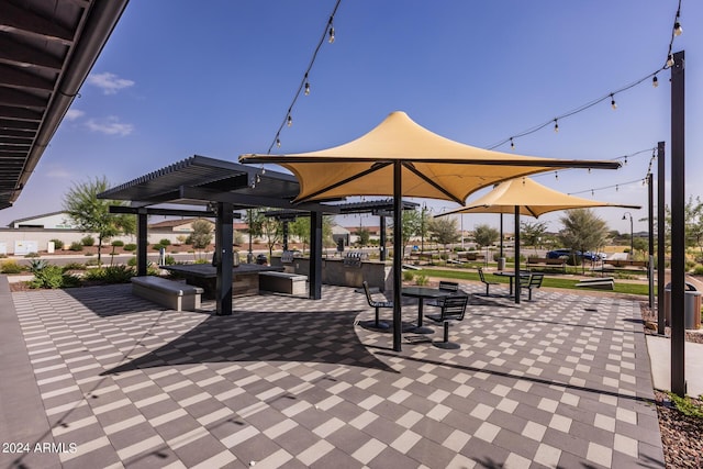 view of property's community with a patio area and a pergola