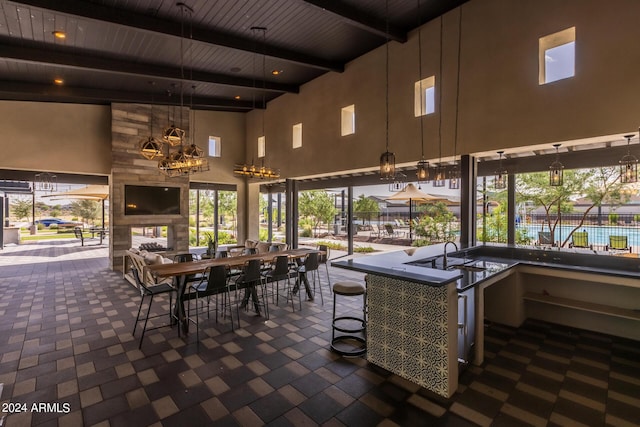 view of patio with outdoor dining area and a sink