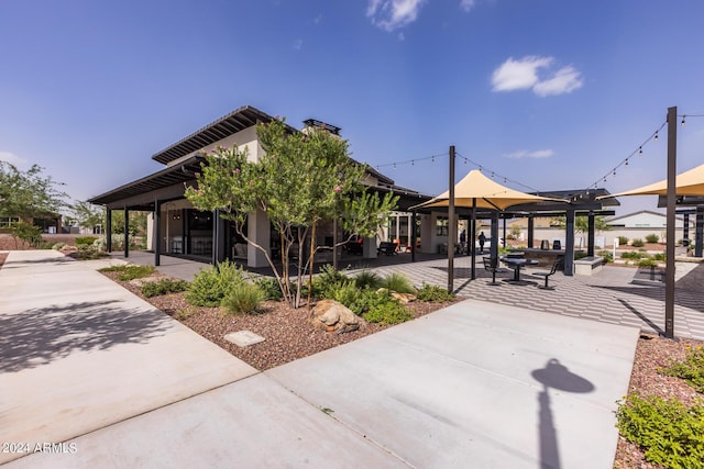 view of property's community featuring a patio