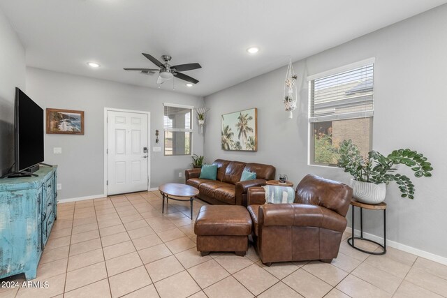 living room featuring light tile patterned floors, baseboards, ceiling fan, and recessed lighting