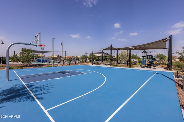 view of sport court with playground community and community basketball court