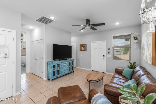 living area featuring light tile patterned floors, visible vents, and recessed lighting