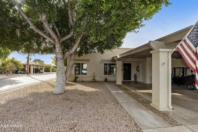 view of front of house featuring a carport