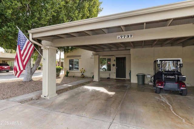 exterior space featuring a carport