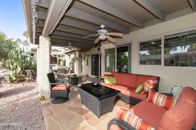 view of patio / terrace with ceiling fan and an outdoor living space