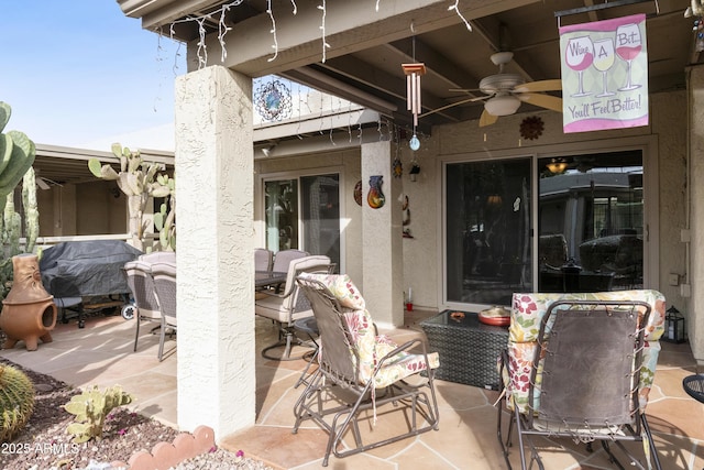 view of patio featuring ceiling fan