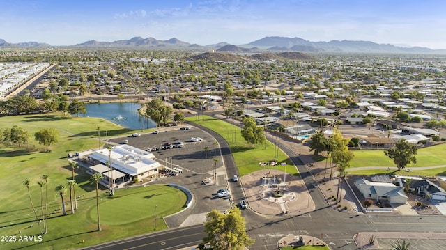 drone / aerial view with a water and mountain view