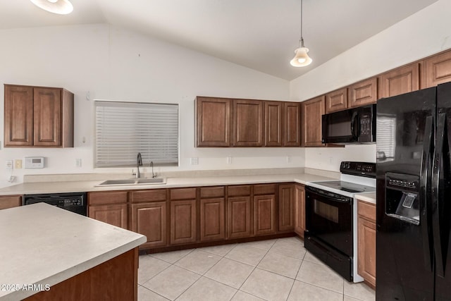 kitchen featuring decorative light fixtures, vaulted ceiling, sink, and black appliances