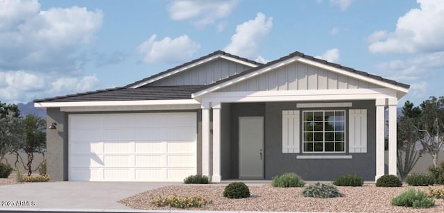 view of front of house with a garage, driveway, and board and batten siding