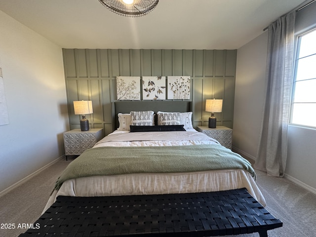 bedroom featuring baseboards and carpet flooring