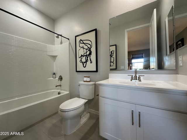 bathroom featuring toilet, bathtub / shower combination, and vanity