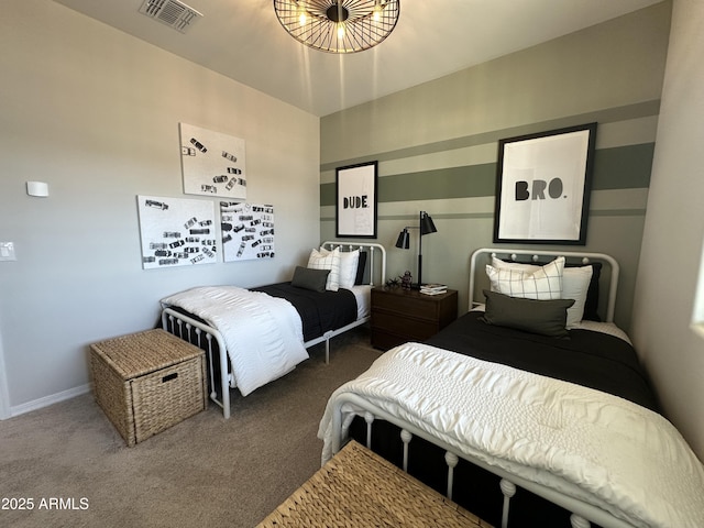 carpeted bedroom featuring visible vents and baseboards