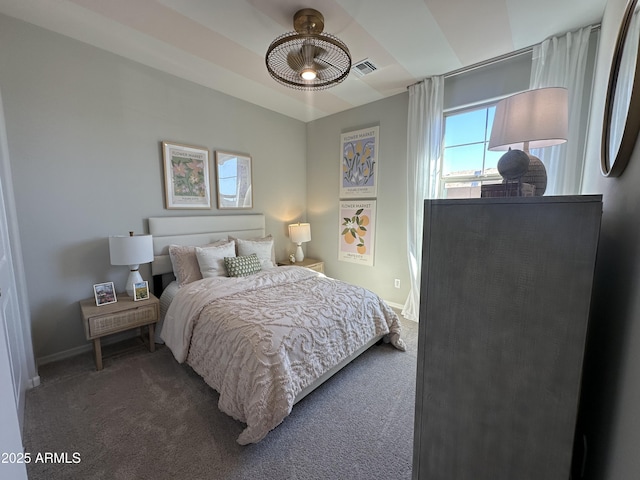 carpeted bedroom with visible vents and baseboards