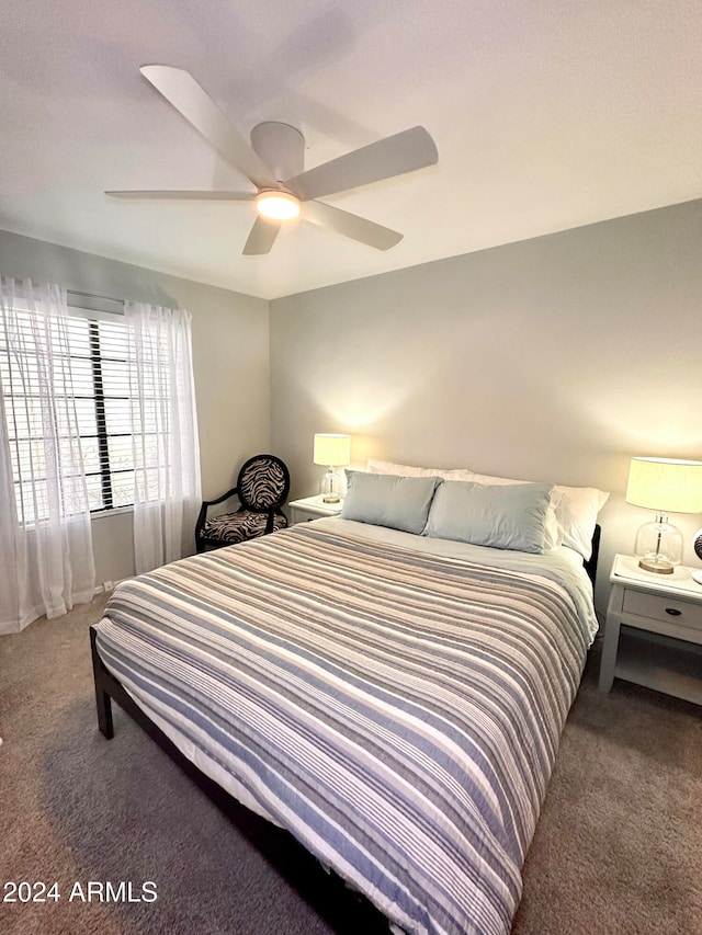 bedroom with ceiling fan and carpet floors