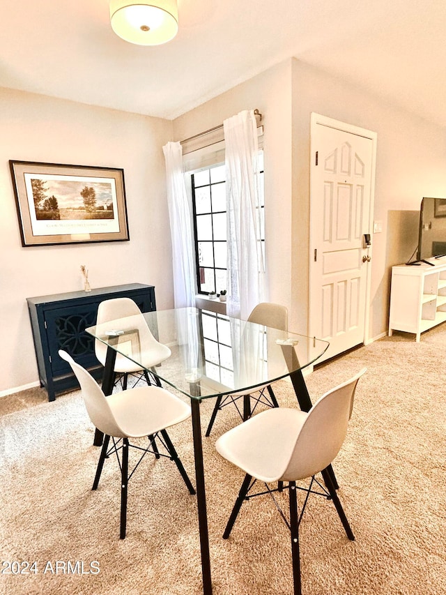 view of carpeted dining space