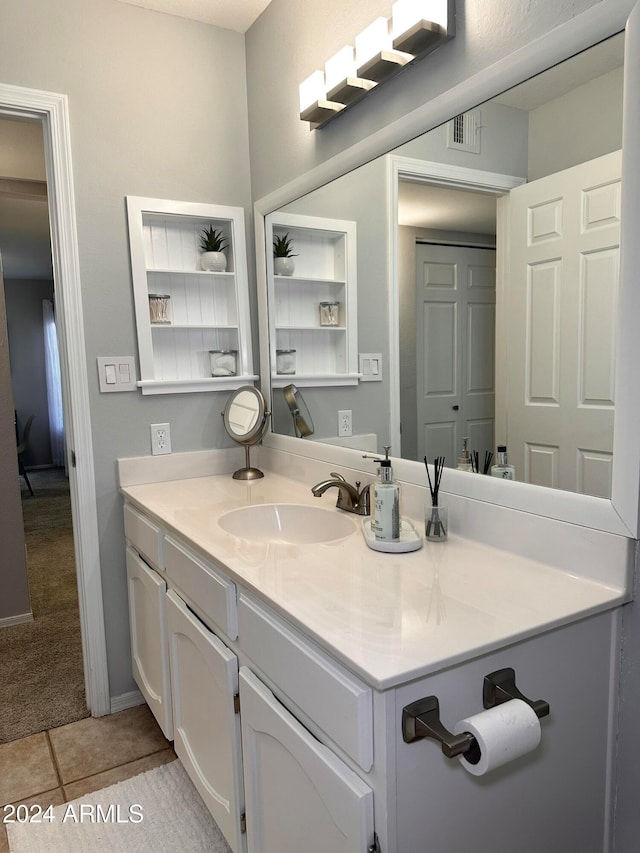 bathroom with tile patterned flooring and vanity