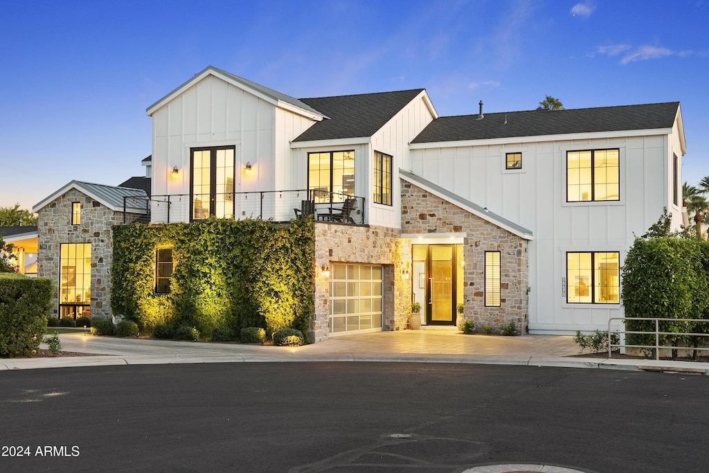 4407 N 37th Way, Phoenix, AZ 85018 - modern inspired farmhouse with stone siding, board and batten siding, and a balcony