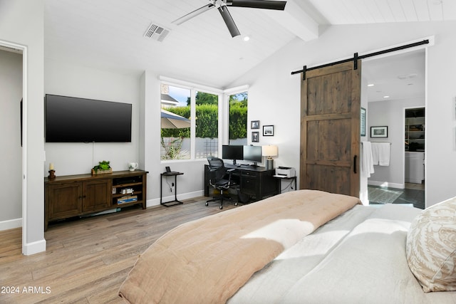 bedroom with a barn door, wood ceiling, lofted ceiling with beams, ceiling fan, and light hardwood / wood-style flooring