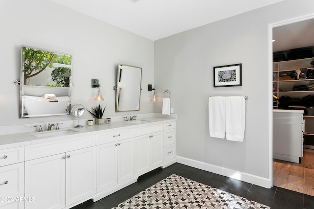 bathroom with vanity and wood-type flooring