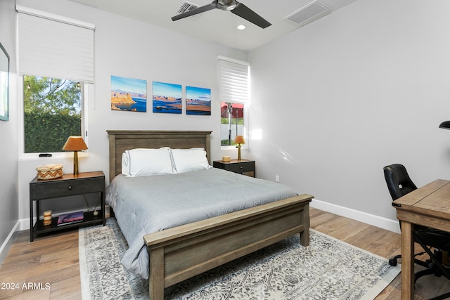 bedroom with light wood-type flooring and ceiling fan