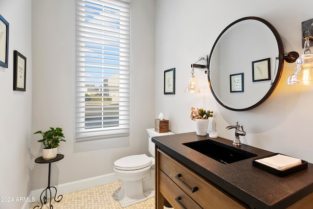 bathroom with toilet and vanity