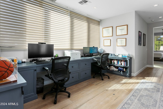 office with light wood-type flooring