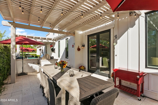 view of patio / terrace with a pergola and french doors