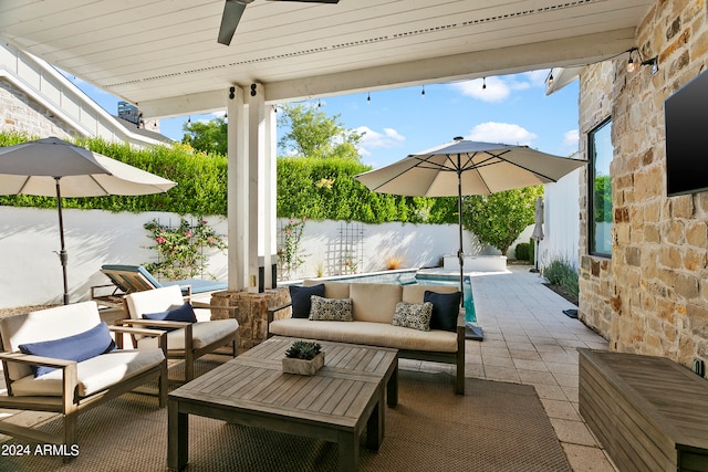 view of patio / terrace with ceiling fan and outdoor lounge area