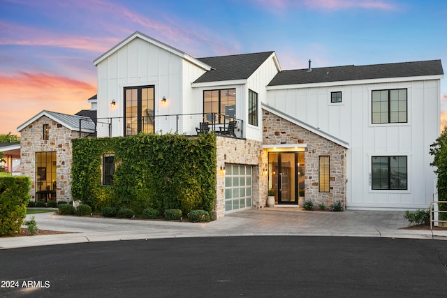 modern farmhouse style home featuring a balcony