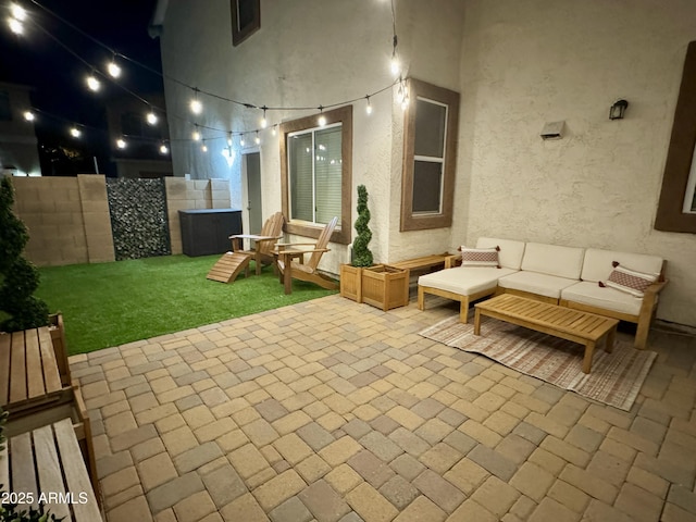 patio at night with an outdoor living space